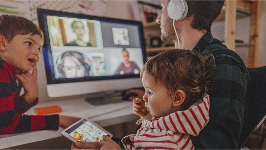 Parents working at home with his child around